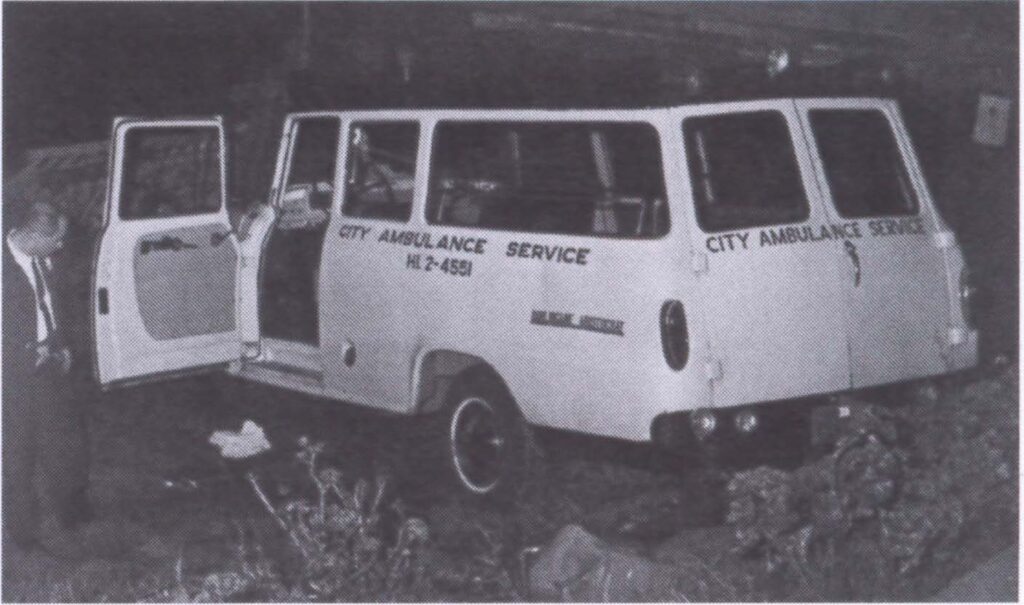 Black and white photo of a mid-century City Ambulance van